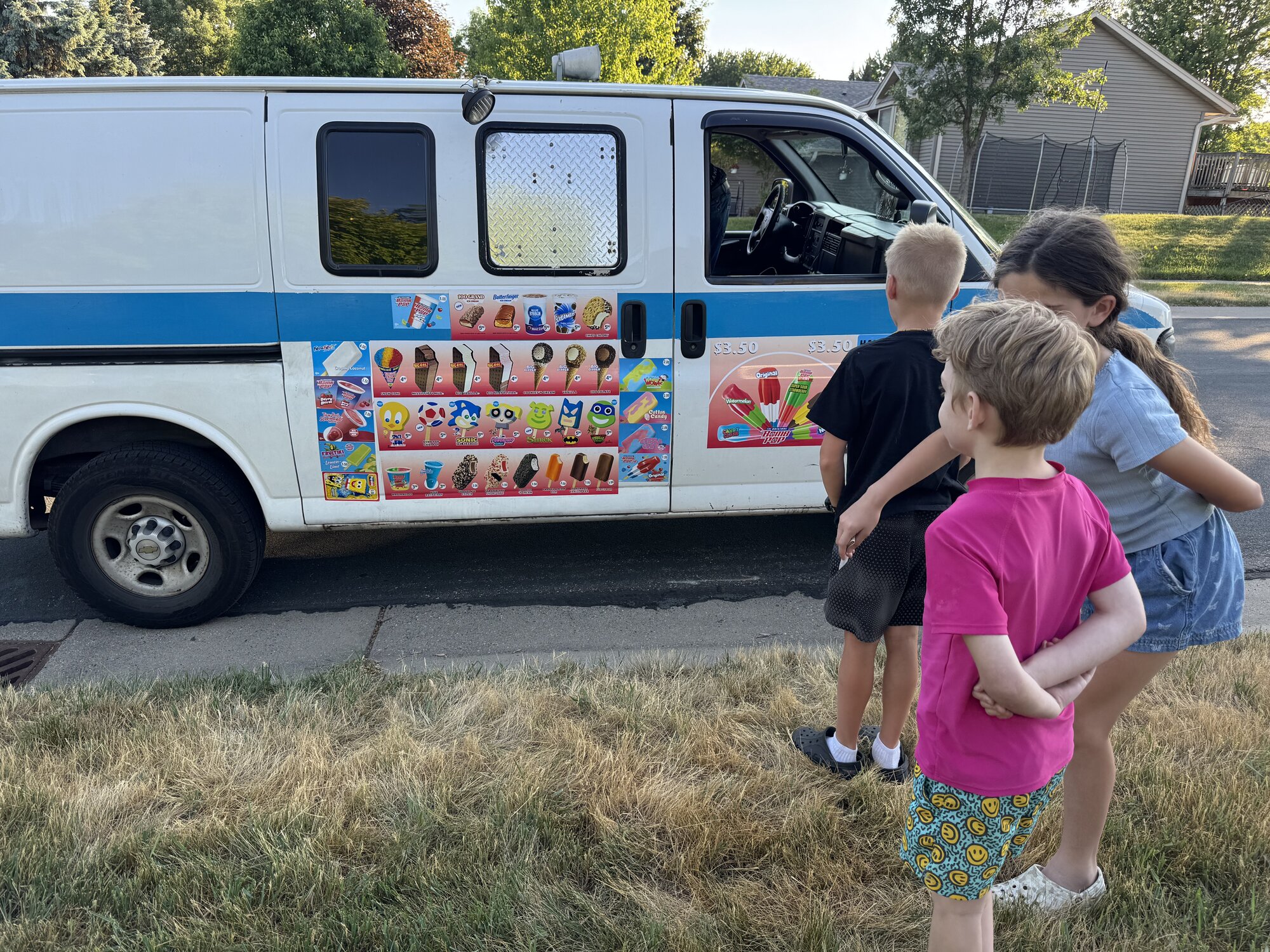 kids waiting at an ice cream truck
