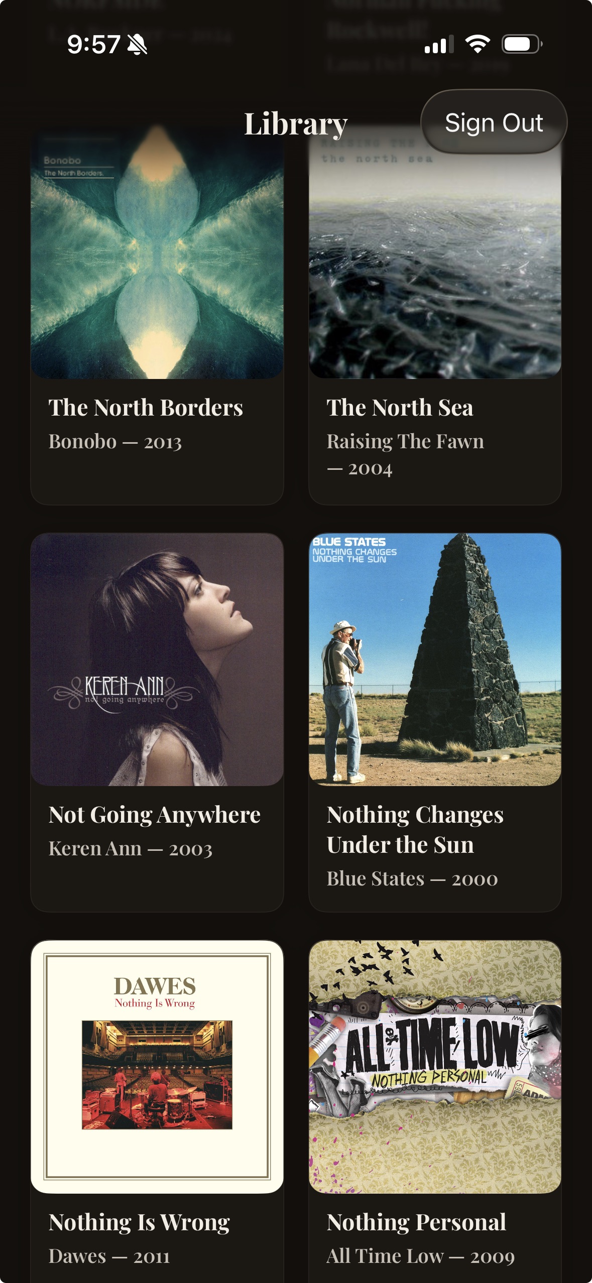 Mobile app library screen showing a grid of music albums with cover art, titles, artists, and years, plus a Sign Out button