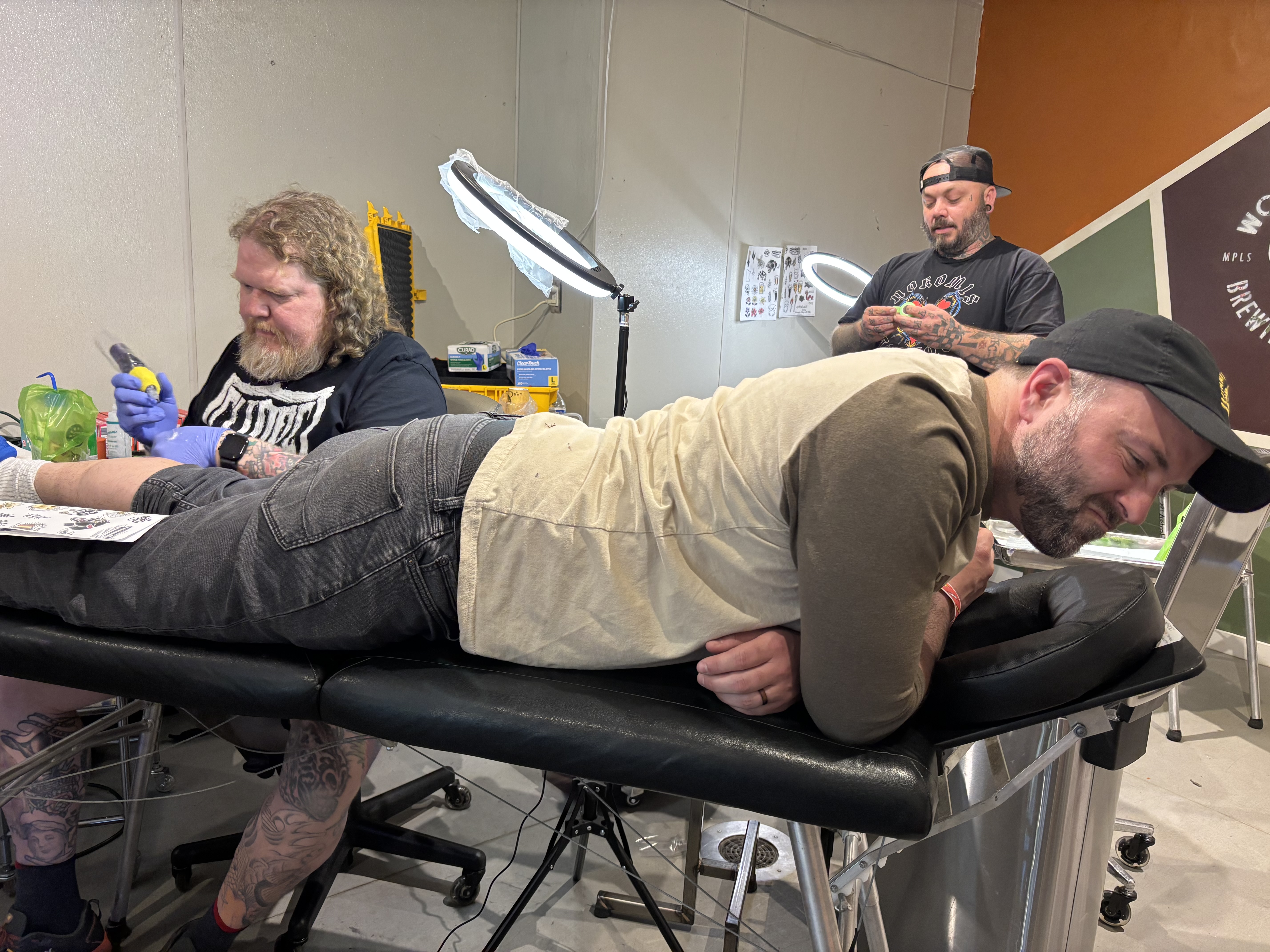 Me, wincing while getting my tattoo